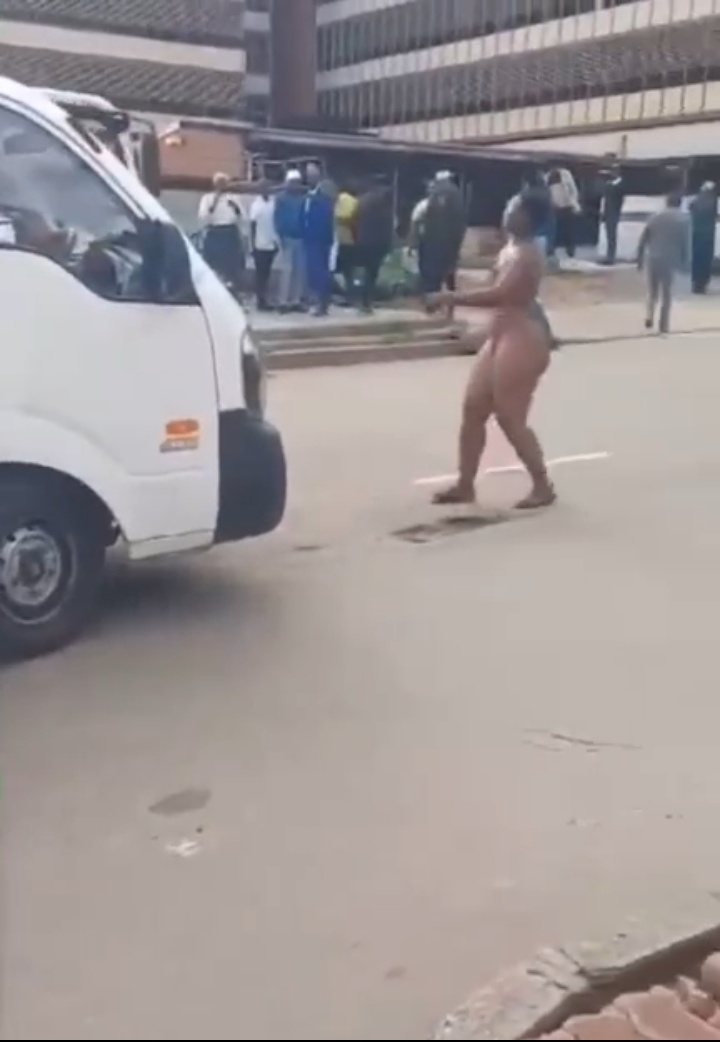 An Insane woman tripped naked on the main road
